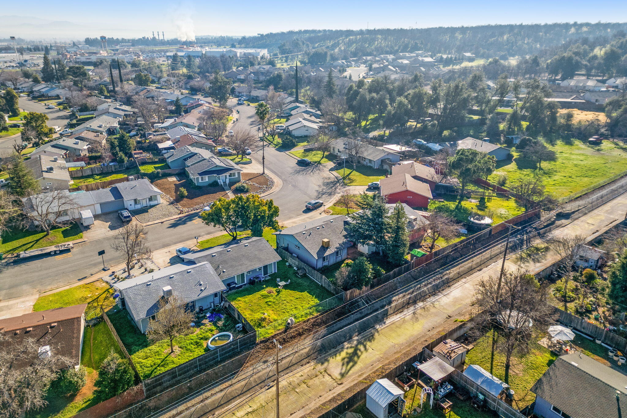 1971 Spruce Circle Anderson, CA 96007 - Photo 29 of 30 an aerial view of swimming pool a playground lake and mountain view in back
