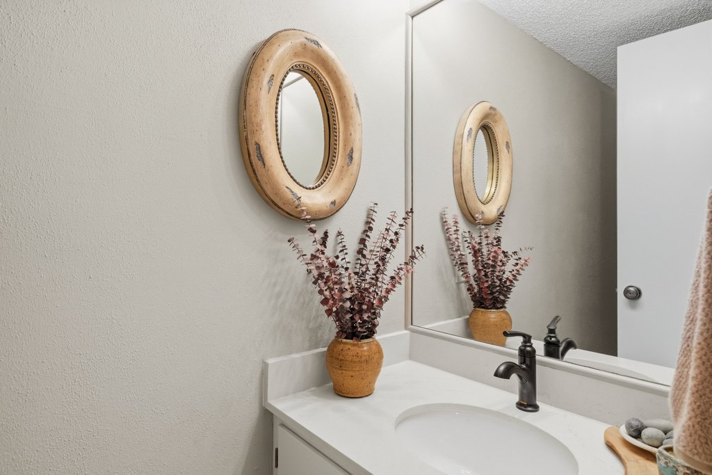 3500 Enfield Road, Unit E Austin, TX 78703 - Photo 37 of 40 A main level powder room is convenient for guests, keeping the full bath private upstairs.