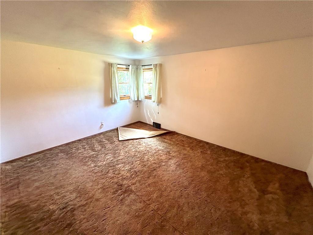 7831 Ridge Road Natrona Heights, PA 15065 - Photo 14 of 39 an empty room with windows