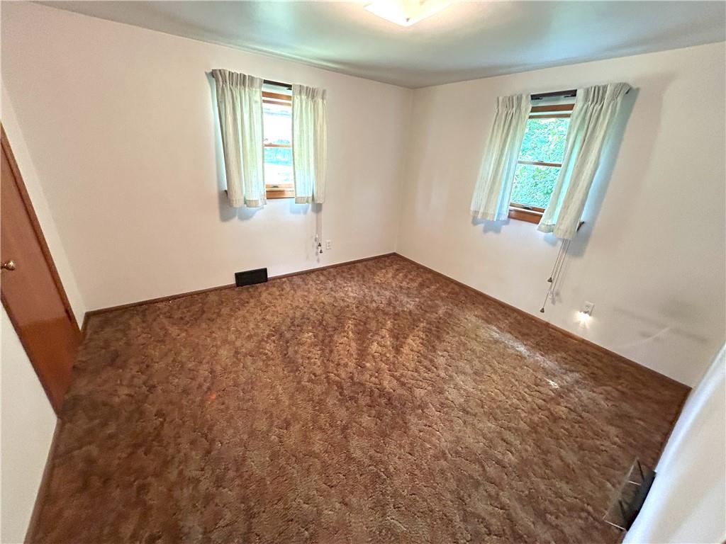 7831 Ridge Road Natrona Heights, PA 15065 - Photo 17 of 39 a view of an empty room and window