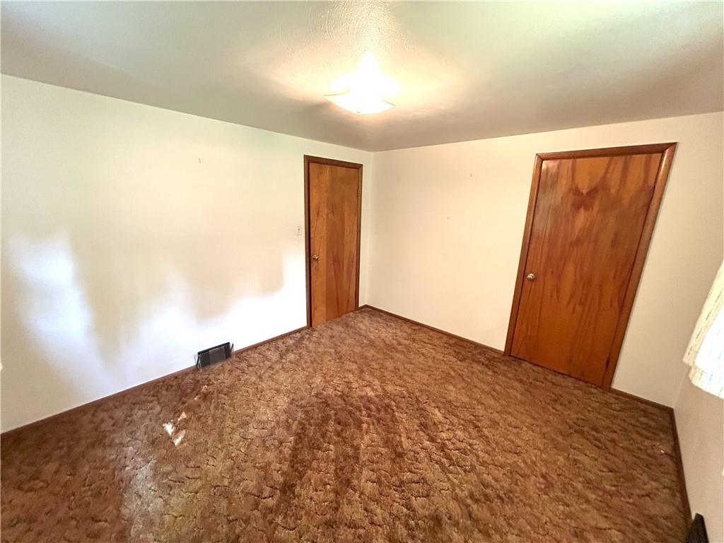7831 Ridge Road Natrona Heights, PA 15065 - Photo 20 of 39 a view of a big room with closet and wooden floor