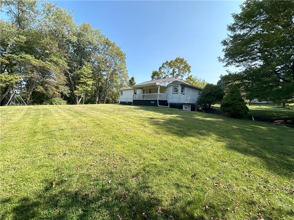 7831 Ridge Road Natrona Heights, PA 15065 - Photo 33 of 39 a swimming pool is sitting in the grass near a big yard