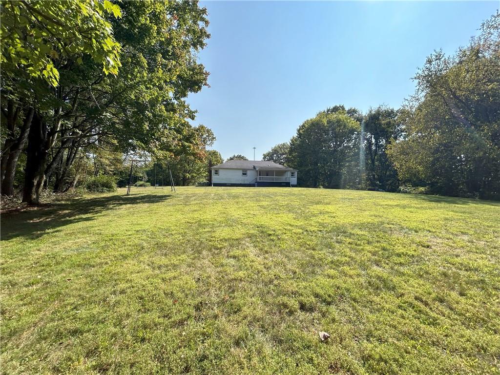7831 Ridge Road Natrona Heights, PA 15065 - Photo 36 of 39 a view of a swimming pool and trees in the background