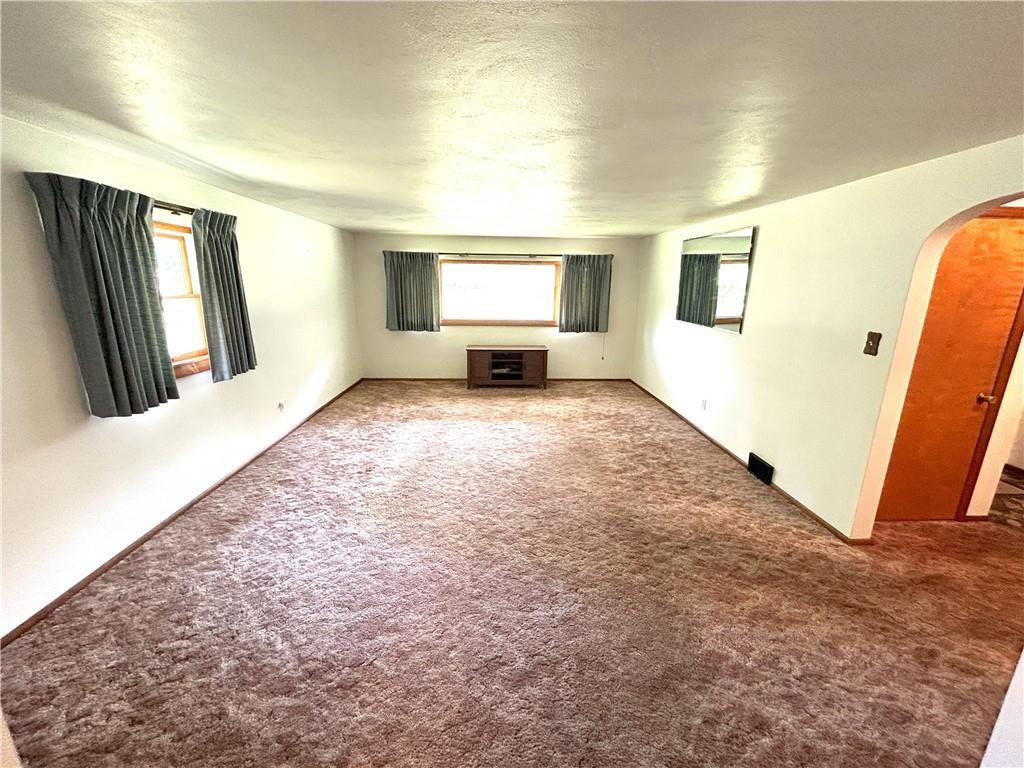 7831 Ridge Road Natrona Heights, PA 15065 - Photo 8 of 39 a view of a livingroom with wooden floor and a window