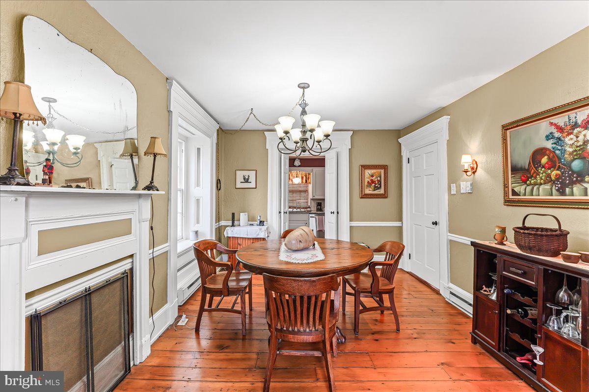 1420 Hollow Road Chester Springs, PA 19425 - Photo 19 of 43 a view of a dining room with furniture and wooden floor