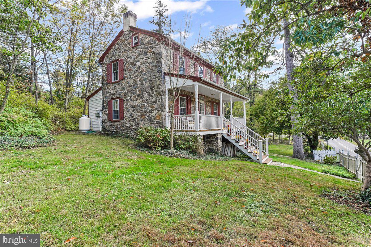 1420 Hollow Road Chester Springs, PA 19425 - Photo 2 of 43 a view of a house with a yard porch and sitting area