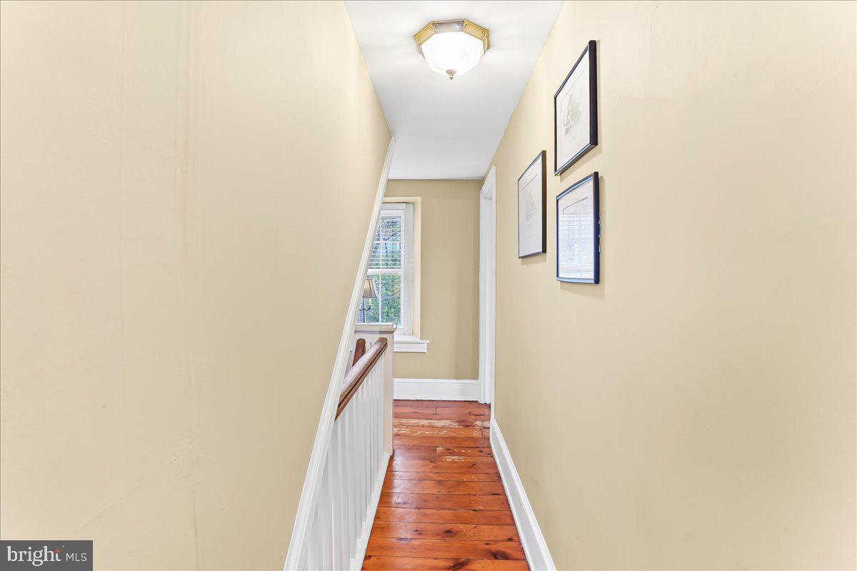 1420 Hollow Road Chester Springs, PA 19425 - Photo 33 of 43 a view of a hallway with wooden floor and staircase