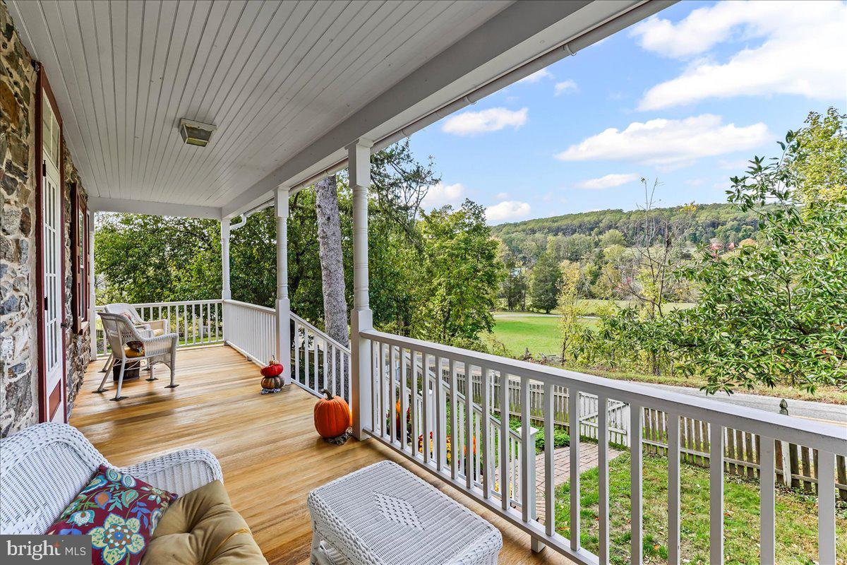 1420 Hollow Road Chester Springs, PA 19425 - Photo 4 of 43 a balcony with chairs and wooden floor