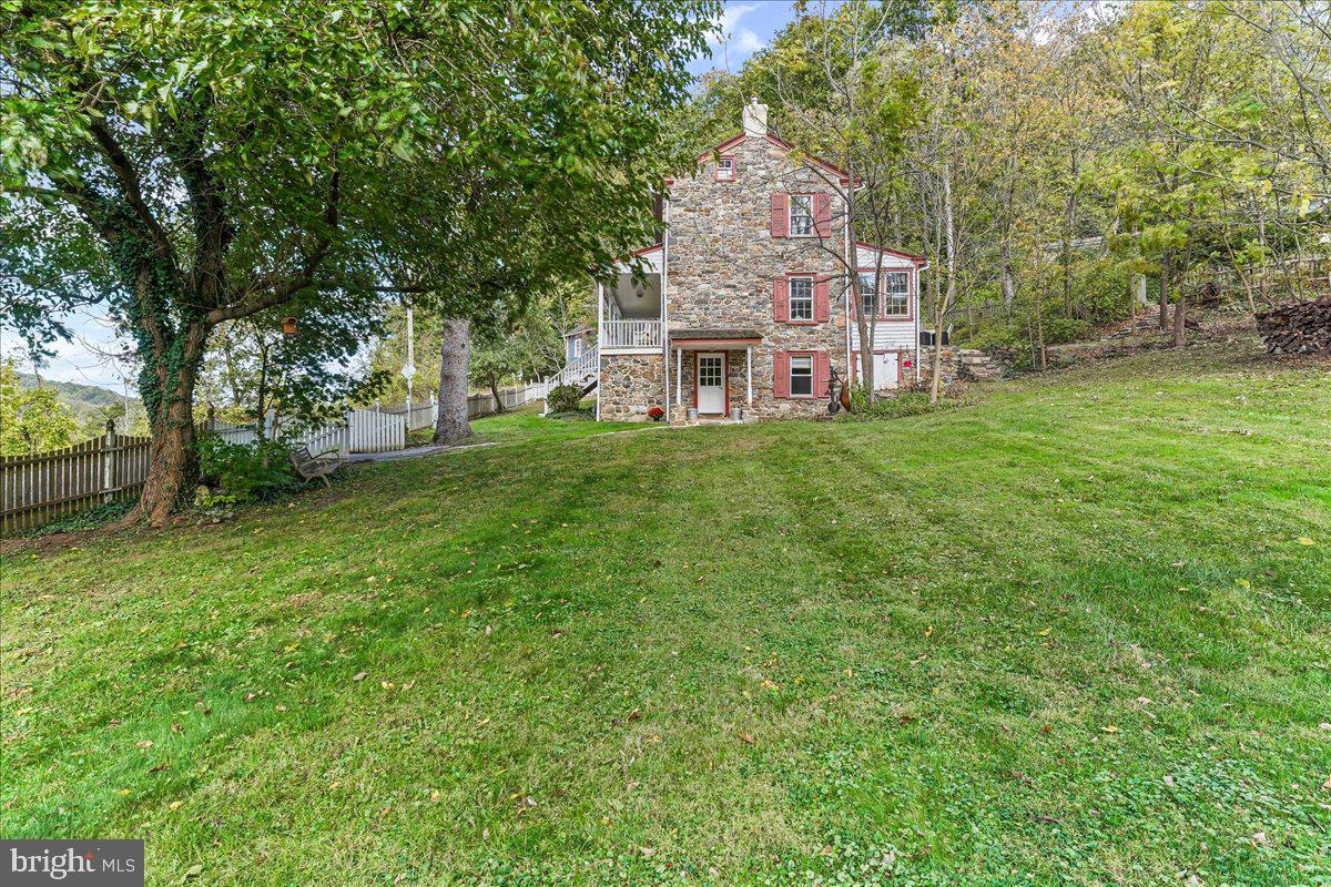 1420 Hollow Road Chester Springs, PA 19425 - Photo 8 of 43 a front view of a house with a garden