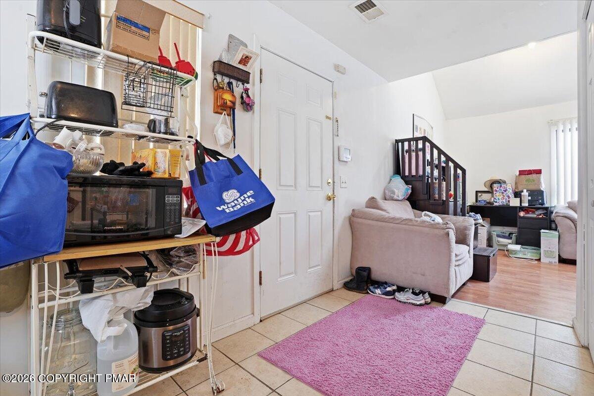3322 Windermere Drive Bushkill, PA 18324 - Photo 15 of 52 a living room with furniture and a flat screen tv