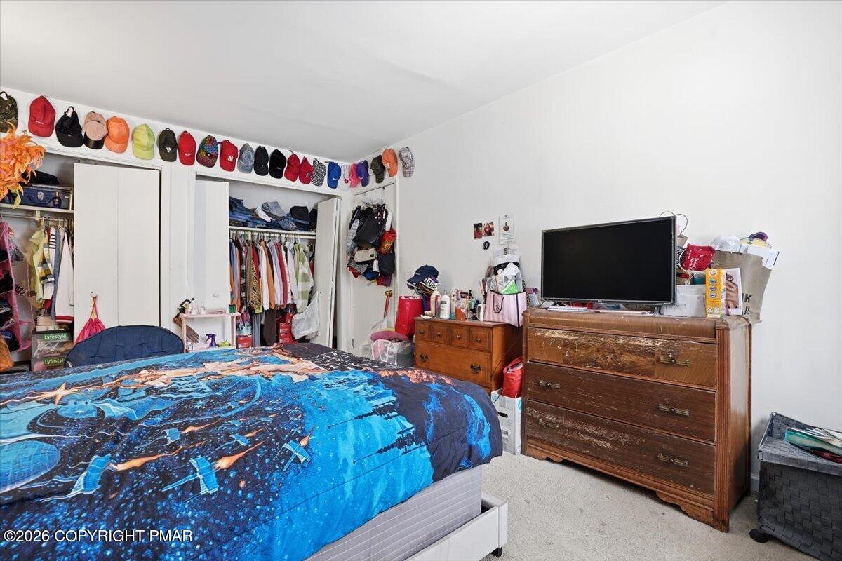 3322 Windermere Drive Bushkill, PA 18324 - Photo 26 of 52 a bed room with a bed and a television