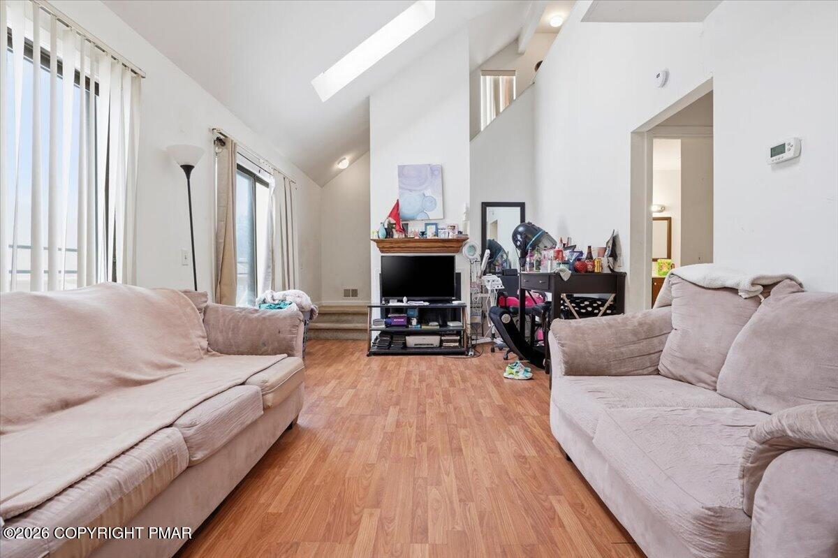 3322 Windermere Drive Bushkill, PA 18324 - Photo 6 of 52 a living room with furniture and a fireplace