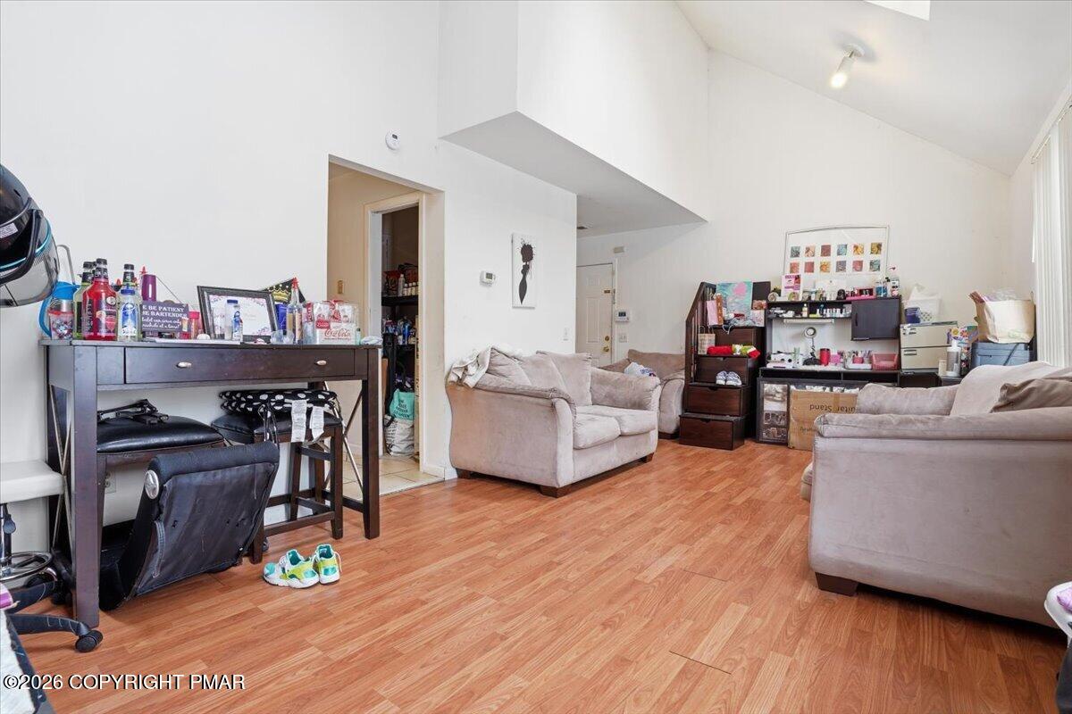 3322 Windermere Drive Bushkill, PA 18324 - Photo 8 of 52 a living room with furniture and a wooden floor