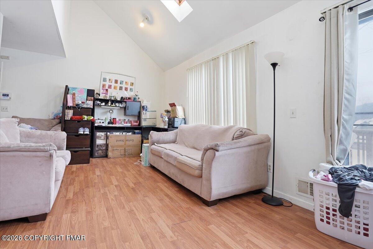 3322 Windermere Drive Bushkill, PA 18324 - Photo 9 of 52 a living room with furniture and a wooden floor