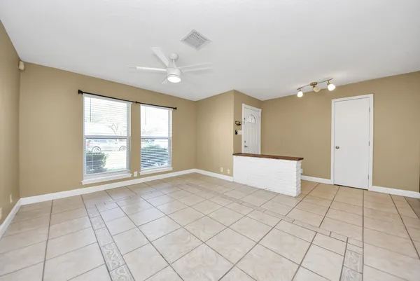 a view of an empty room with a window
