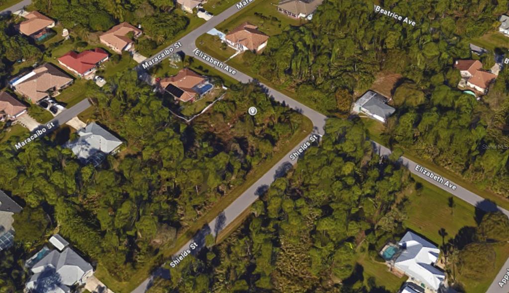 1365 Shields Street Punta Gorda, FL 33980 - Photo 14 of 14 an aerial view of residential houses with outdoor space