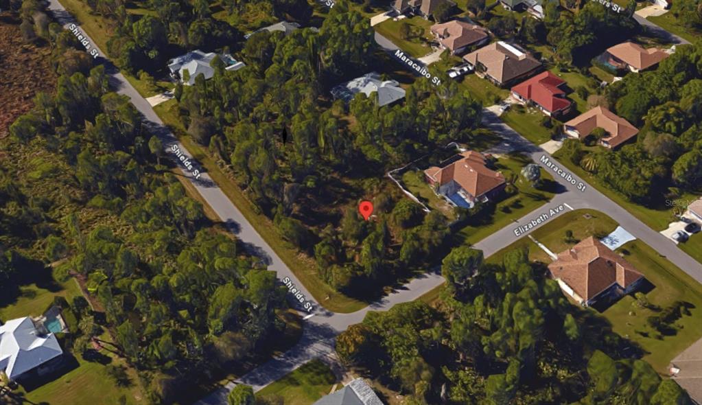 1365 Shields Street Punta Gorda, FL 33980 - Photo 9 of 14 an aerial view of residential houses with outdoor space