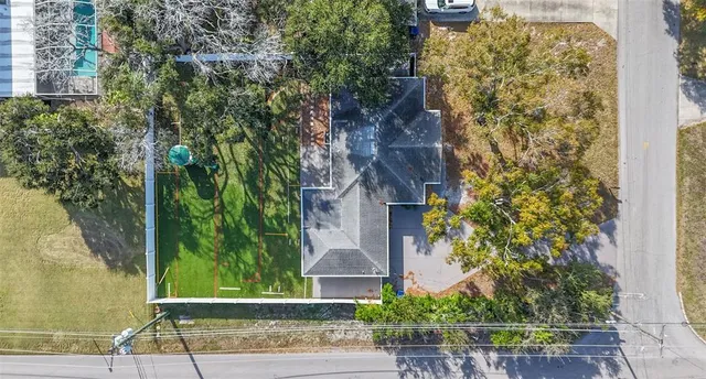front view of a brick house with a yard