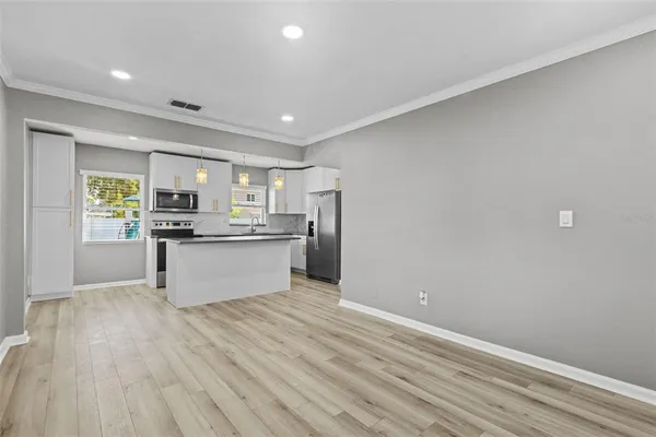 a view of kitchen with wooden floor