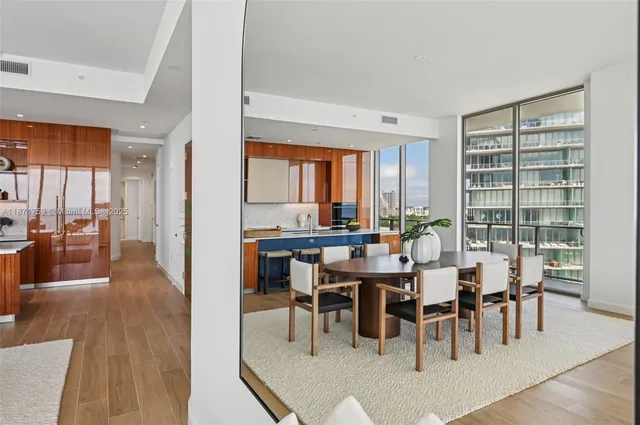 a kitchen with stainless steel appliances granite countertop a stove and a refrigerator