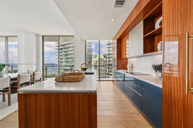 a hallway with a large window and couch