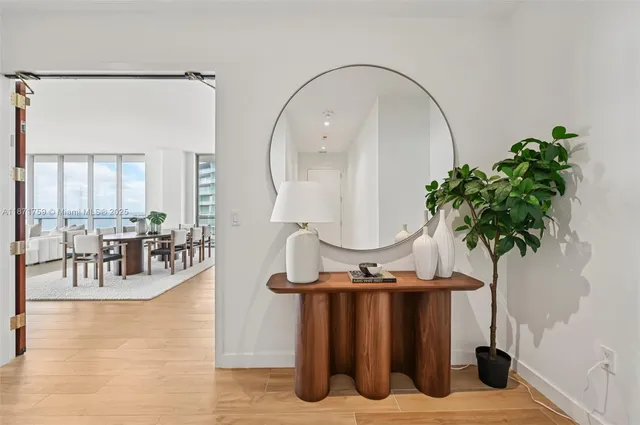 a bedroom with a bed and a mirror