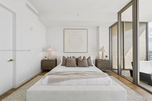 a bathroom with a bathtub sink and mirror