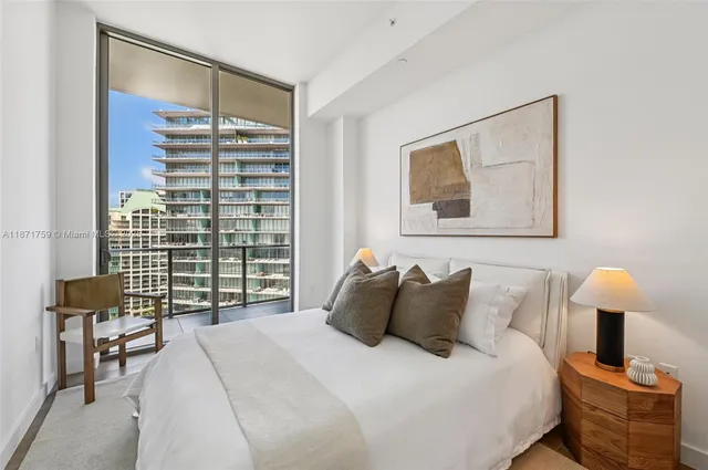 a bathroom with a toilet a sink and a mirror