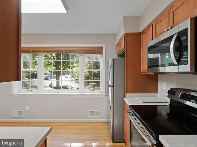 a kitchen with sink cabinets and window