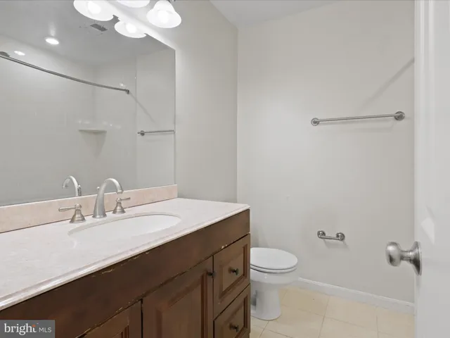 a bathroom with a bath tub with a shower