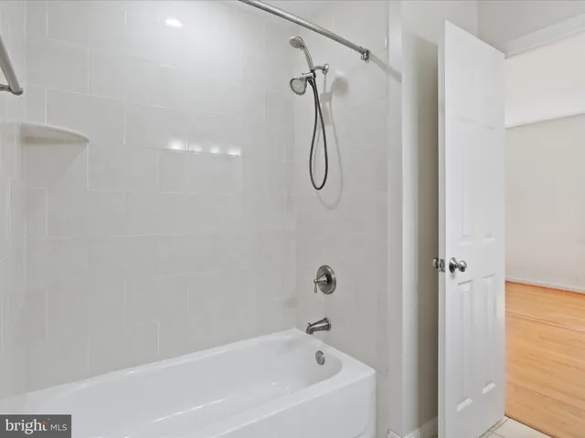 a bathroom with a sink vanity and a mirror
