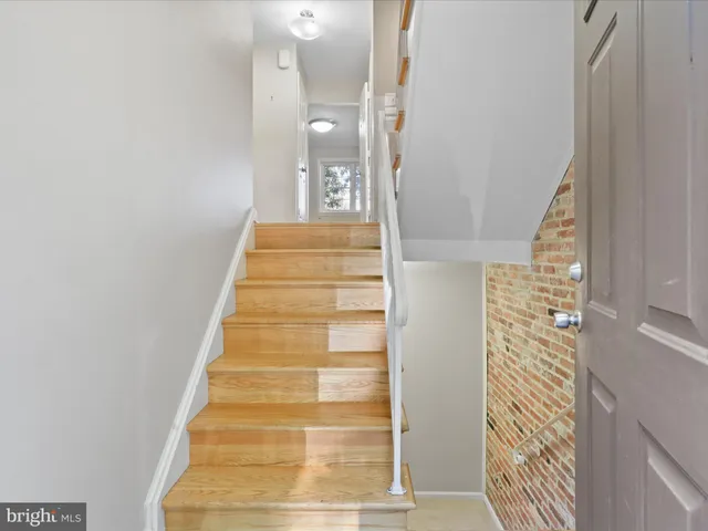 a view of a room with wooden floor and closet