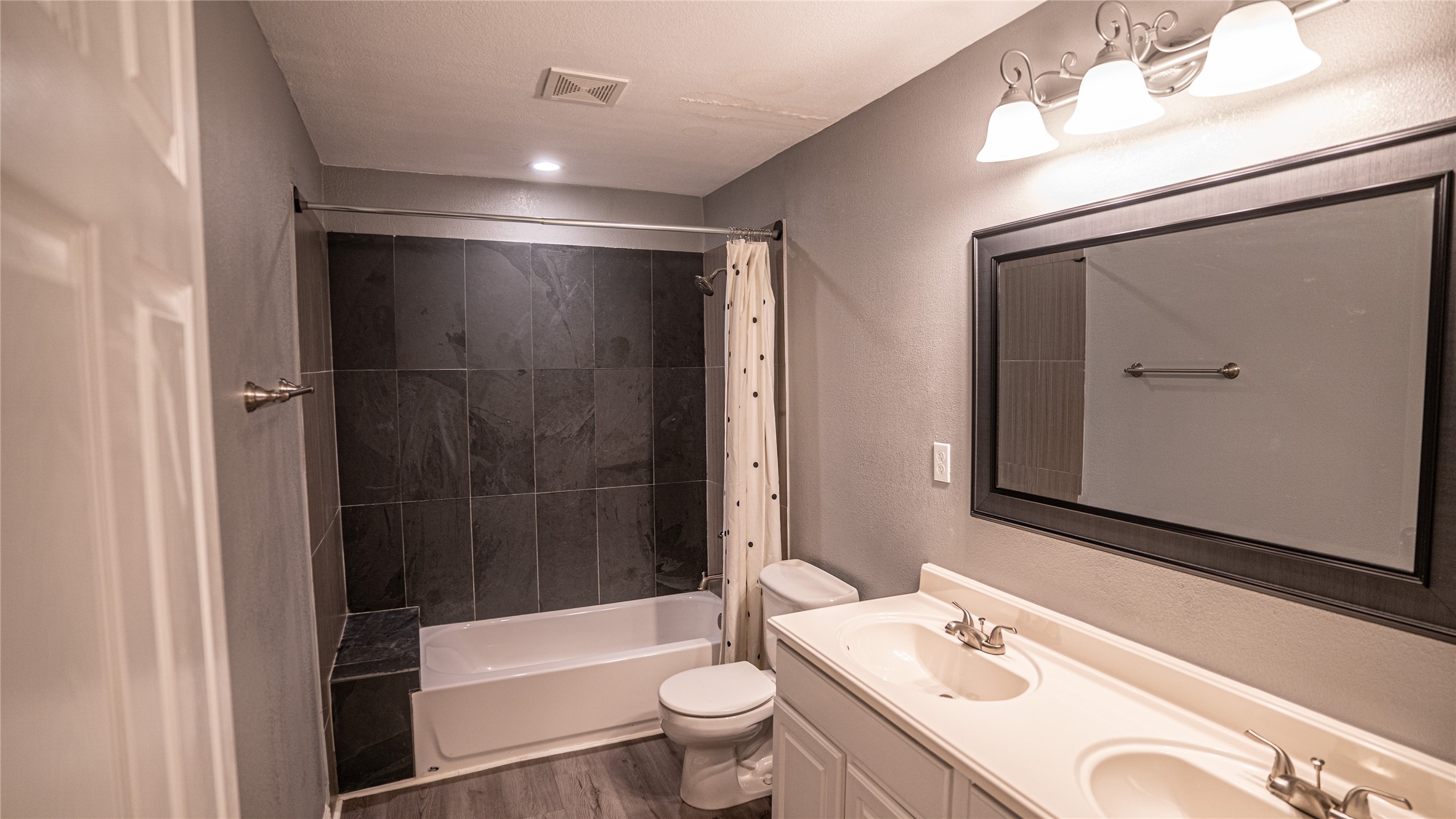 106 West Hoopes Avenue Pflugerville, TX 78660 - Photo 14 of 17 Hall Bathroom with double vanities.