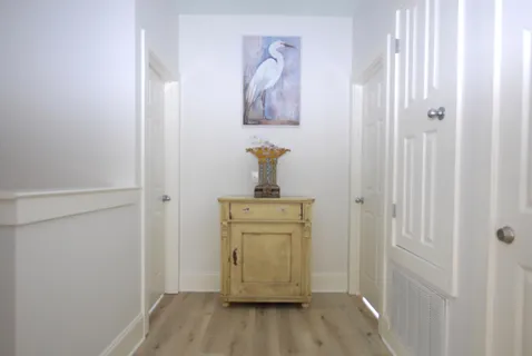 a room with a door and wooden floor