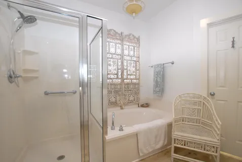 a bathroom with a tub and shower