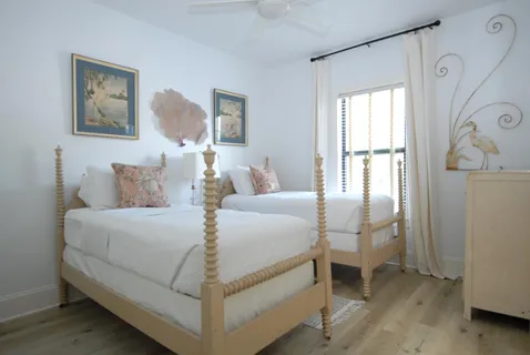 a bed room with a bed and a window