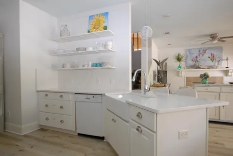 a view of cabinets a sink and dishwasher in a kitchen
