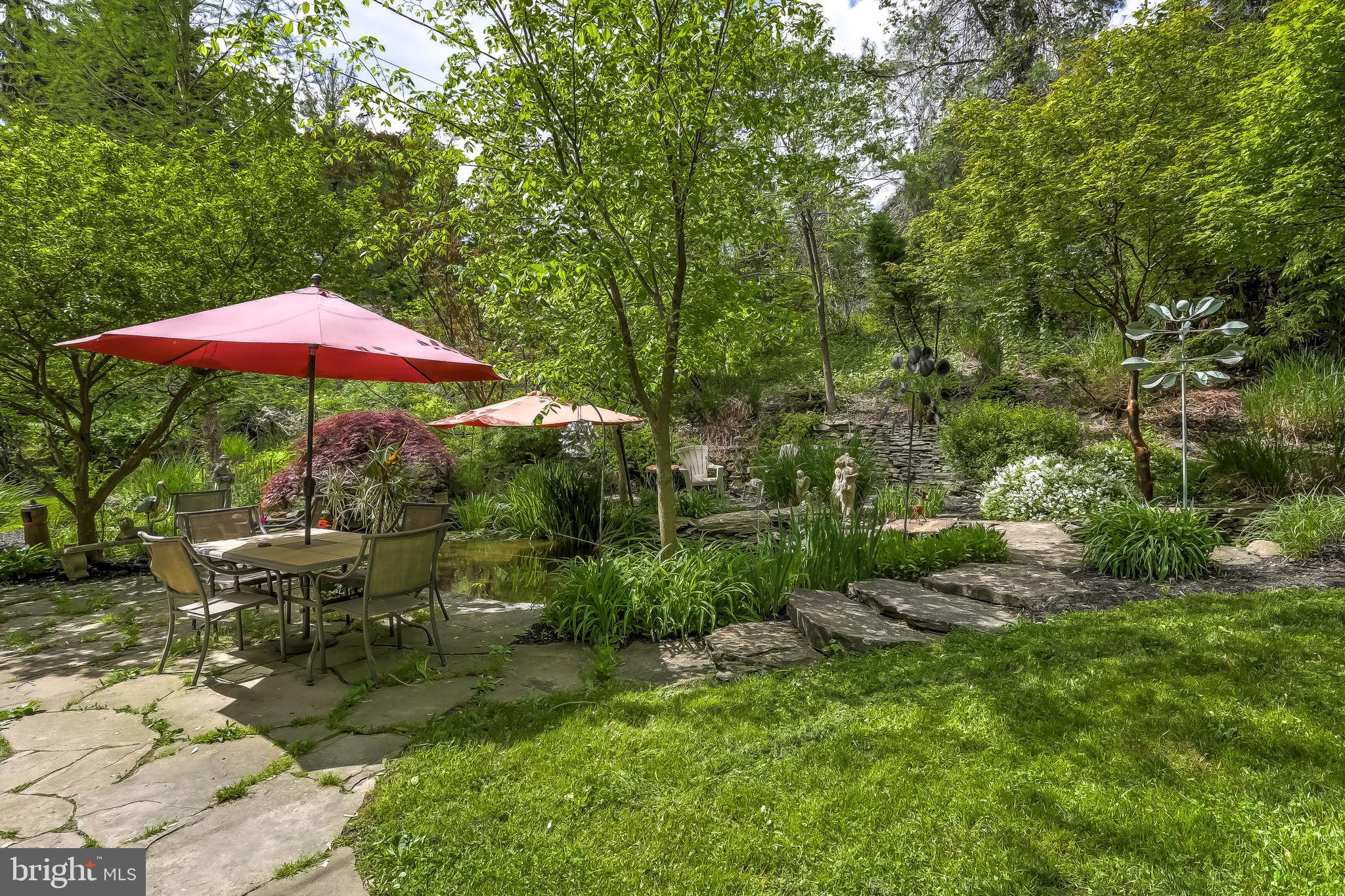 1802 Dixon Road Baltimore, MD 21209 - Photo 57 of 61 An absolute oasis! Stone patio with Koi pond