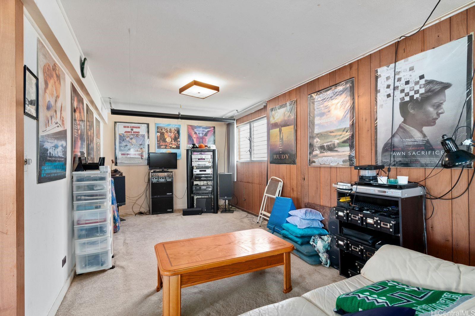 3404 Ala Hinalo Place Honolulu, HI 96818 - Photo 10 of 11 a room with furniture a rug and a floor to ceiling window