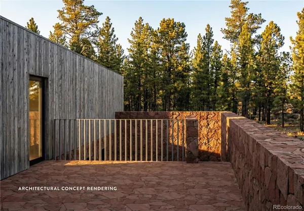 a view of a wooden fence and trees