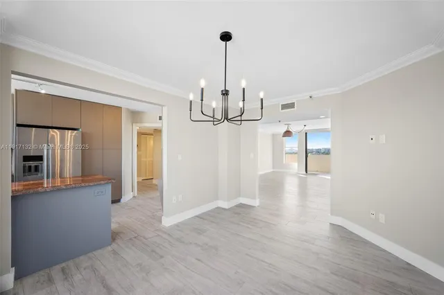 a view of a room with cabinet and windows