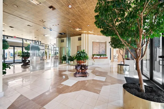 a view of a lobby with chair and tables