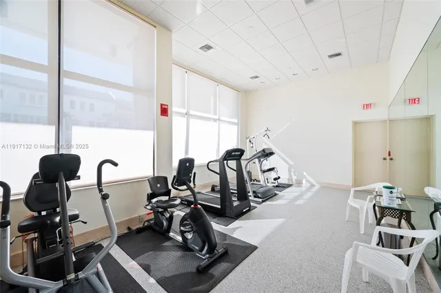 a view of swimming pool with outdoor seating and plants