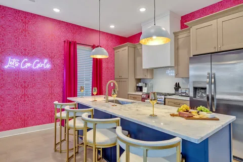 a kitchen with stainless steel appliances granite countertop a stove and a refrigerator