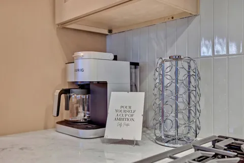 a bathroom with a sink a mirror and a shower