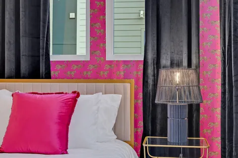 a bathroom with a double vanity sink mirror and shower