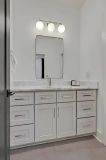 a bathroom with a shower and a sink