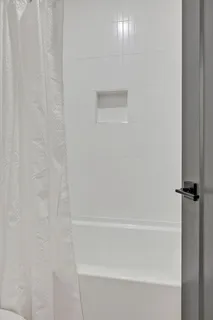 a view of livingroom with an empty space and window