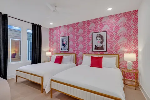 a bedroom with a bed and a mirror