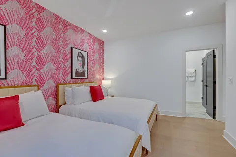 a en suite bathroom with a granite countertop sink and a mirror